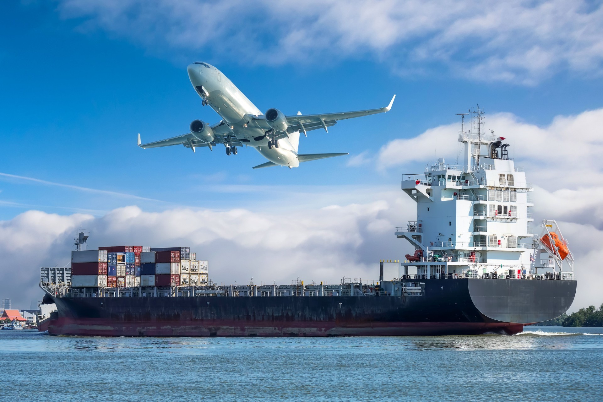 Ship with liquid cargo or containers floats along the river, an airplane taking off in the sky. Concept of cargo transportation by sea and air.